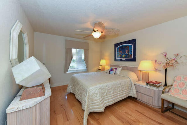 150 Beach Summit Ct, Jupiter, FL 33477 - bedroom with light wood-style floors, ceiling fan, and baseboards