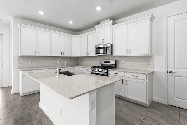19659 Rugged Trunk Trl, Loxahatchee, FL 33470 - kitchen with stainless steel appliances, a sink, tasteful backsplash, tile patterned flooring, and recessed lighting