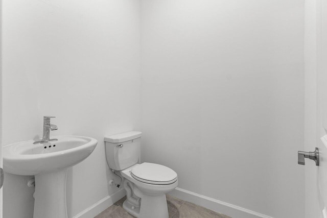 19659 Rugged Trunk Trl, Loxahatchee, FL 33470 - half bathroom featuring baseboards and toilet