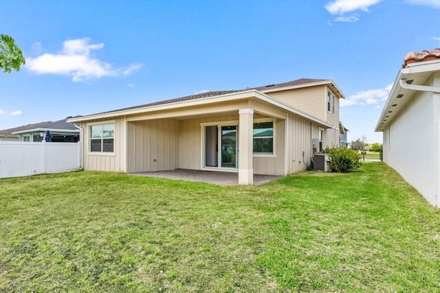 19659 Rugged Trunk Trl, Loxahatchee, FL 33470 - back of house with a patio area and central AC