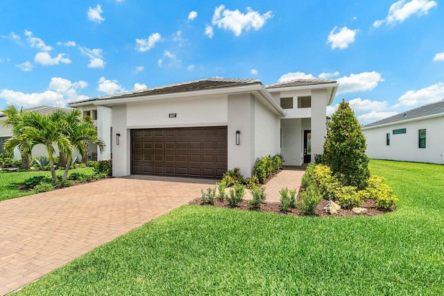 4817 Saint Armands Way, Westlake, FL 33470 - view of front of property with decorative driveway, a garage, stucco siding, and a front yard