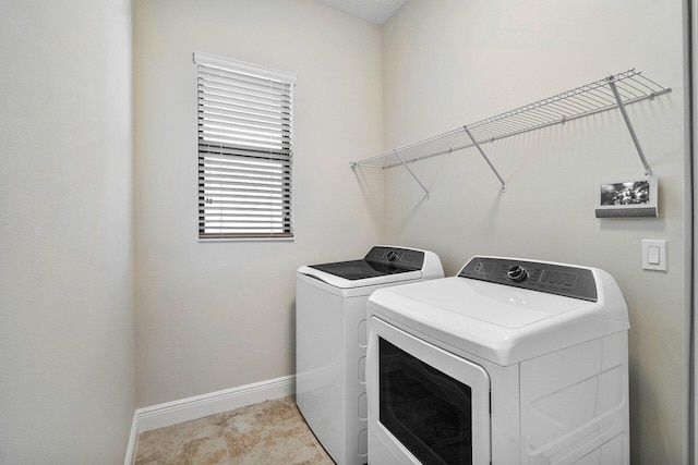 4817 Saint Armands Way, Westlake, FL 33470 - washroom with washing machine and clothes dryer and baseboards