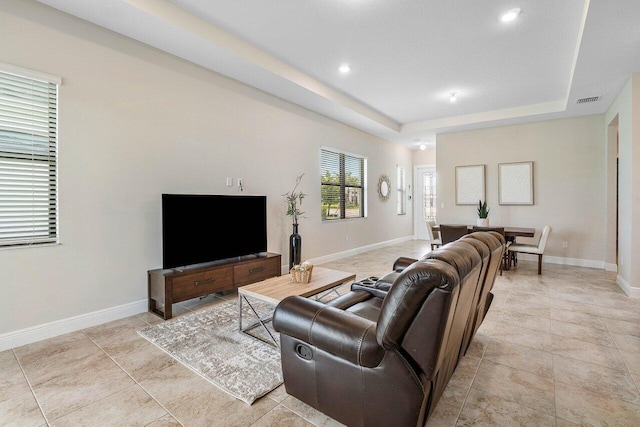 4817 Saint Armands Way, Westlake, FL 33470 - living area featuring a tray ceiling, baseboards, light tile patterned floors, and recessed lighting