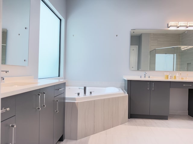 8803 Skyward St, Boca Raton, FL 33496 - bathroom with a shower stall, two vanities, a bath, and tile patterned flooring
