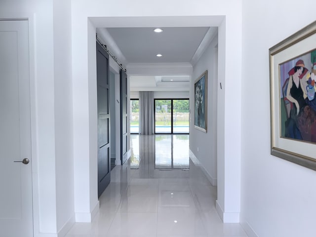 8803 Skyward St, Boca Raton, FL 33496 - corridor with baseboards, a barn door, light tile patterned flooring, crown molding, and recessed lighting