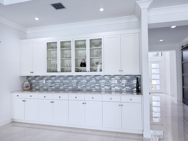 8803 Skyward St, Boca Raton, FL 33496 - bar featuring tasteful backsplash, ornamental molding, recessed lighting, and baseboards