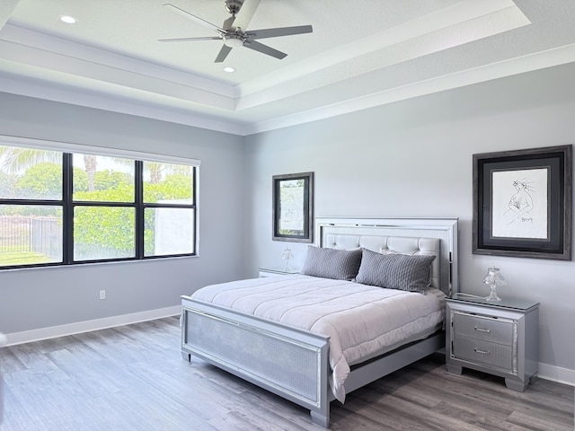 8803 Skyward St, Boca Raton, FL 33496 - bedroom with a raised ceiling, wood finished floors, baseboards, recessed lighting, and a ceiling fan