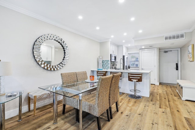 200 E Royal Palm Rd Unit 3040, Boca Raton, FL 33432 - dining space with ornamental molding, light wood-style flooring, recessed lighting, and baseboards