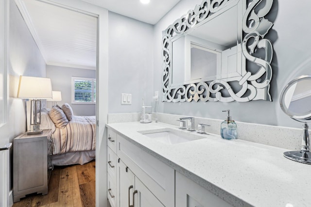 200 E Royal Palm Rd Unit 3040, Boca Raton, FL 33432 - ensuite bathroom featuring wood finished floors, ornamental molding, and vanity