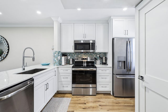 200 E Royal Palm Rd Unit 3040, Boca Raton, FL 33432 - kitchen with appliances with stainless steel finishes, a sink, white cabinetry, recessed lighting, and tasteful backsplash