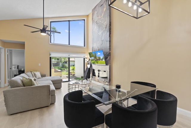 10650 NW 30th Pl Unit 1, Sunrise, FL 33322 - living room with ceiling fan, wood finished floors, and a towering ceiling