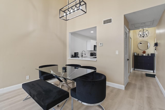 10650 NW 30th Pl Unit 1, Sunrise, FL 33322 - dining area with light wood-type flooring and baseboards