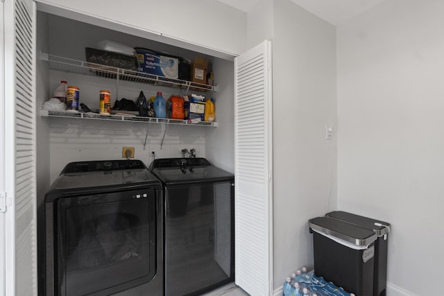 10650 NW 30th Pl Unit 1, Sunrise, FL 33322 - laundry room featuring washing machine and dryer, bar with sink, and baseboards