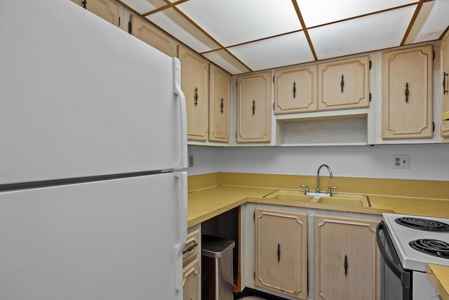 300 NW 30th Ct Unit 202, Pompano Beach, FL 33064 - kitchen featuring freestanding refrigerator, a sink, light countertops, electric range oven, and light brown cabinetry
