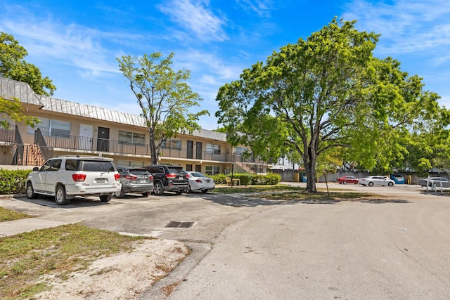 300 NW 30th Ct Unit 202, Pompano Beach, FL 33064 - view of building exterior with uncovered parking