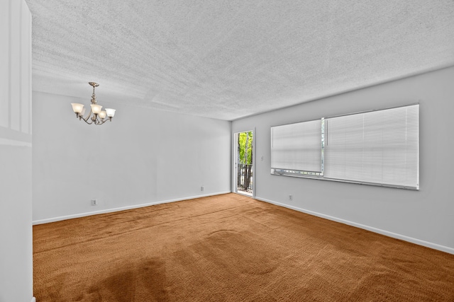 300 NW 30th Ct Unit 202, Pompano Beach, FL 33064 - carpeted empty room with a chandelier, a textured ceiling, and baseboards