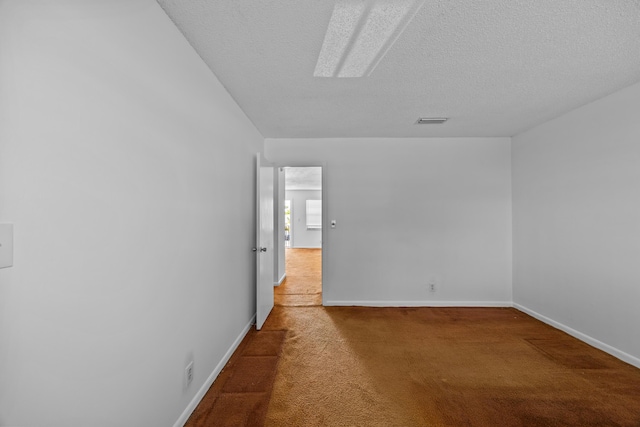 300 NW 30th Ct Unit 202, Pompano Beach, FL 33064 - carpeted spare room with baseboards and a textured ceiling