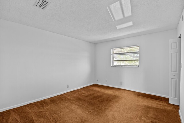 300 NW 30th Ct Unit 202, Pompano Beach, FL 33064 - unfurnished room with carpet floors, a textured ceiling, and baseboards