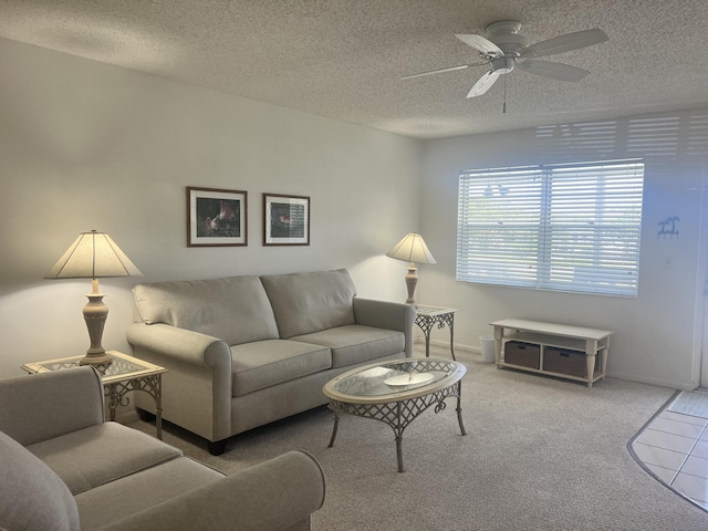 23 Lyndhurst A 23, Deerfield Beach, FL 33442 - carpeted living room featuring a ceiling fan and a textured ceiling