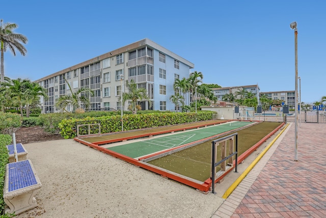 2018 S Federal Hwy Unit 304, Boynton Beach, FL 33435 - view of home's community with a bocce ball area and fence