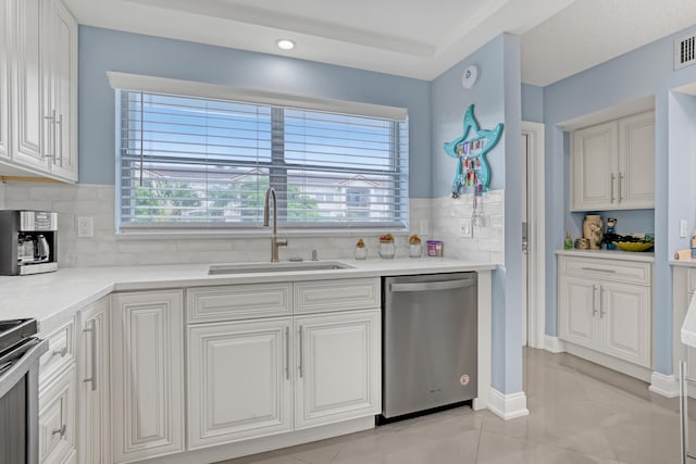 2018 S Federal Hwy Unit 304, Boynton Beach, FL 33435 - kitchen featuring stainless steel dishwasher, a sink, stove, tasteful backsplash, and healthy amount of natural light