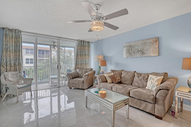 2018 S Federal Hwy Unit 304, Boynton Beach, FL 33435 - living area featuring a wall of windows, ceiling fan, light tile patterned floors, and a textured ceiling