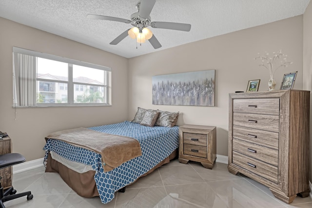 2018 S Federal Hwy Unit 304, Boynton Beach, FL 33435 - bedroom with a textured ceiling, baseboards, and ceiling fan