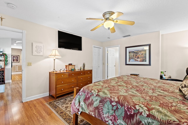 15180 69th Dr N, Palm Beach Gardens, FL 33418 - bedroom with light wood-style flooring, baseboards, and a ceiling fan