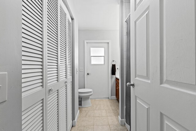 15180 69th Dr N, Palm Beach Gardens, FL 33418 - corridor with light tile patterned flooring and baseboards