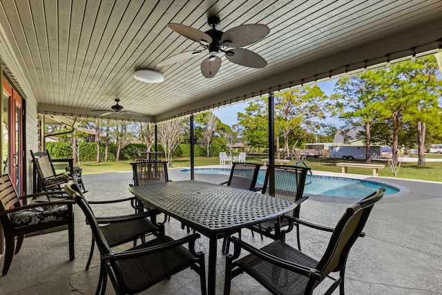 15180 69th Dr N, Palm Beach Gardens, FL 33418 - view of patio / terrace featuring ceiling fan, outdoor dining space, and an outdoor pool