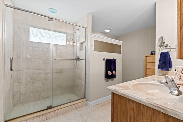 15180 69th Dr N, Palm Beach Gardens, FL 33418 - full bathroom featuring tile patterned flooring, a shower stall, baseboards, and vanity