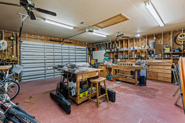 15180 69th Dr N, Palm Beach Gardens, FL 33418 - garage featuring a workshop area and a garage door opener