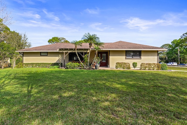 15180 69th Dr N, Palm Beach Gardens, FL 33418 - single story home with a front yard