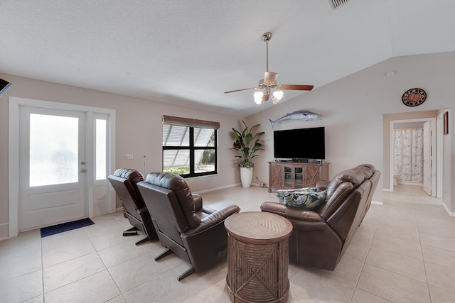 11195 N 159th Ct N, Jupiter, FL 33478 - living room featuring light tile patterned flooring, ceiling fan, lofted ceiling, and baseboards