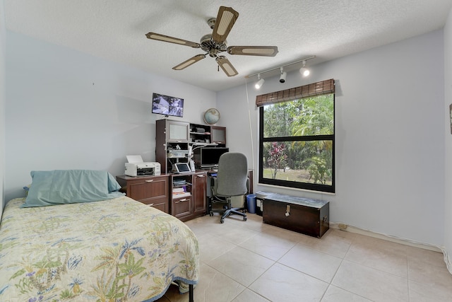 11195 N 159th Ct N, Jupiter, FL 33478 - bedroom with track lighting, an office area, light tile patterned floors, a textured ceiling, and a ceiling fan