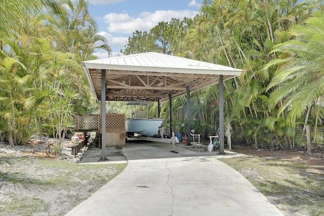 11195 N 159th Ct N, Jupiter, FL 33478 - view of patio featuring driveway and a carport