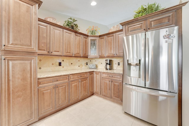 11195 N 159th Ct N, Jupiter, FL 33478 - kitchen featuring stainless steel refrigerator with ice dispenser, light stone counters, light tile patterned floors, decorative backsplash, and recessed lighting