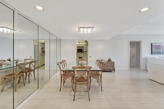2697 N Ocean Blvd Unit 407-F, Boca Raton, FL 33431 - dining space featuring recessed lighting, light wood-style floors, and a ceiling fan