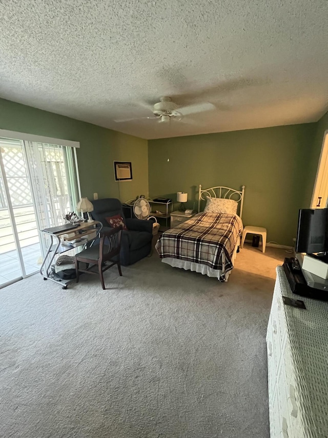262 Sussex M, West Palm Beach, FL 33417 - bedroom with carpet, a textured ceiling, access to exterior, and a ceiling fan