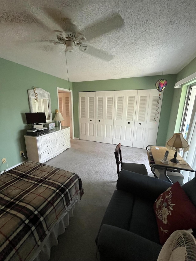 262 Sussex M, West Palm Beach, FL 33417 - bedroom with carpet, a textured ceiling, ceiling fan, and a closet