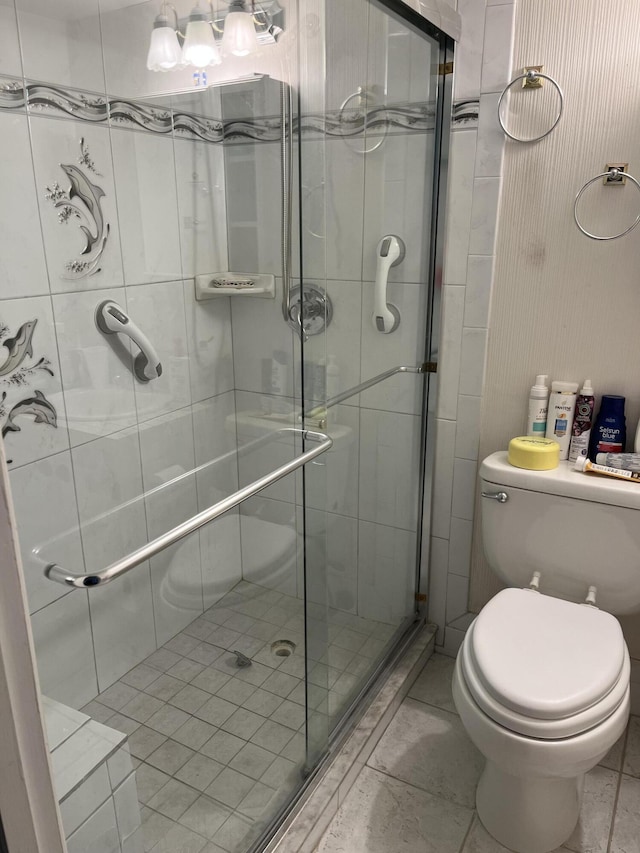 262 Sussex M, West Palm Beach, FL 33417 - bathroom featuring toilet and a shower stall