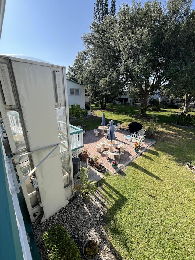 262 Sussex M, West Palm Beach, FL 33417 - view of grassy yard with a patio area and a fire pit