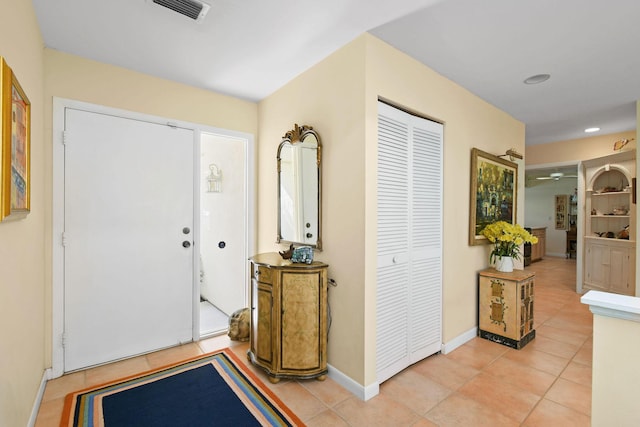 17187 Bay St, Jupiter, FL 33477 - foyer featuring light tile patterned floors, baseboards, a ceiling fan, and recessed lighting