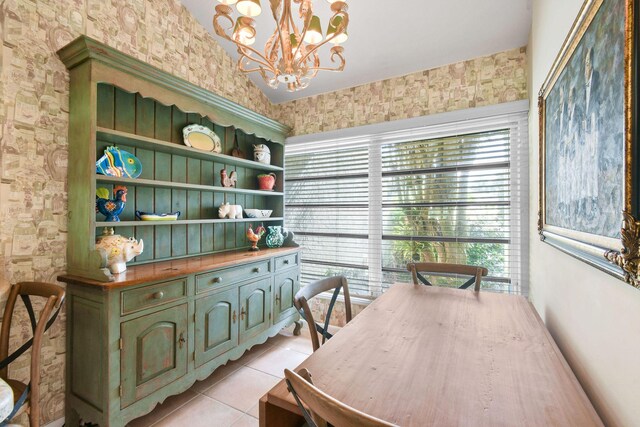 17187 Bay St, Jupiter, FL 33477 - dining area with light tile patterned floors and a chandelier