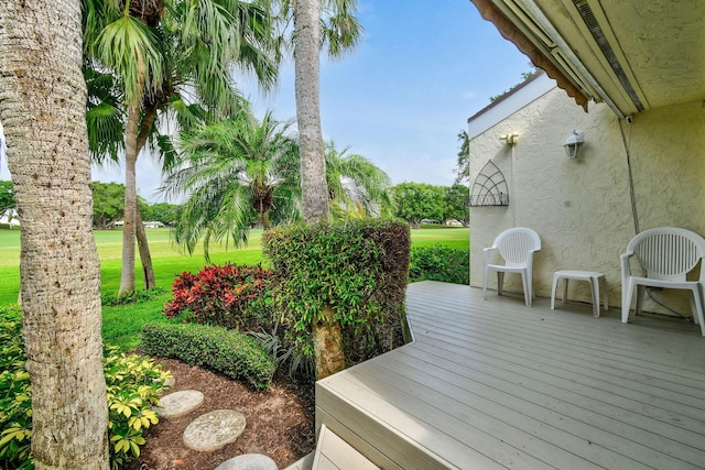17187 Bay St, Jupiter, FL 33477 - wooden terrace featuring a lawn