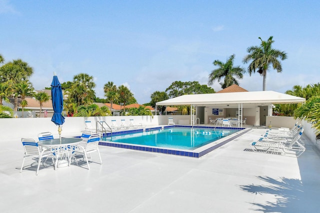 17187 Bay St, Jupiter, FL 33477 - community pool with a patio area