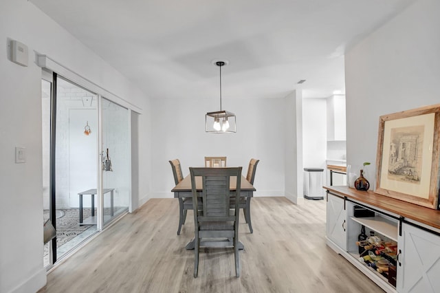 10164 40th Way S Unit 256, Boynton Beach, FL 33436 - dining area featuring light wood-type flooring and baseboards