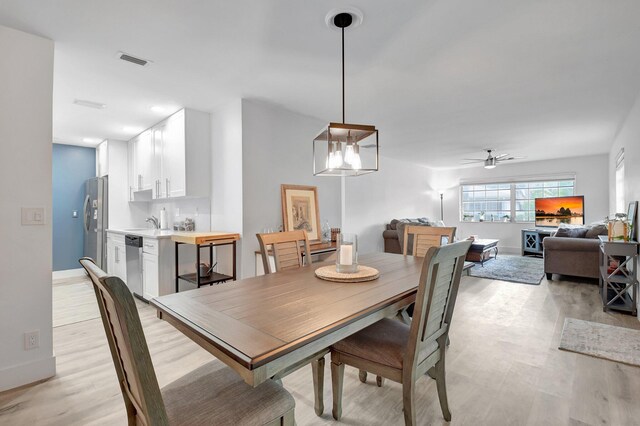 10164 40th Way S Unit 256, Boynton Beach, FL 33436 - dining room with light wood-style floors, ceiling fan, and baseboards