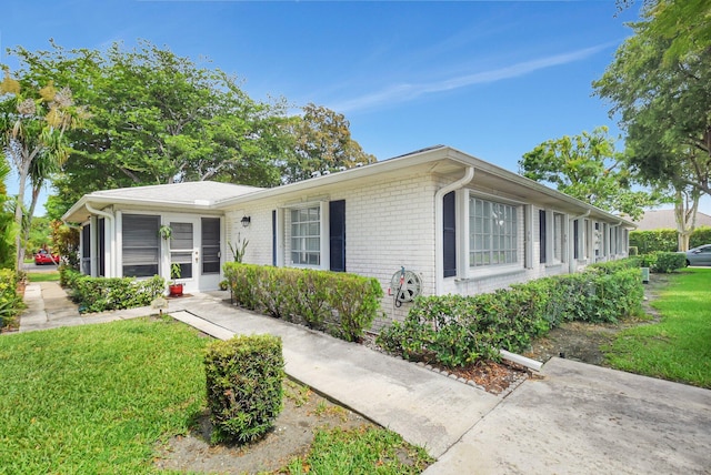10164 40th Way S Unit 256, Boynton Beach, FL 33436 - ranch-style home with a front yard and brick siding