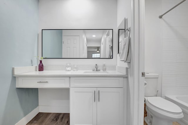 10164 40th Way S Unit 256, Boynton Beach, FL 33436 - full bath featuring vanity, toilet, shower / bathtub combination, wood finished floors, and a ceiling fan